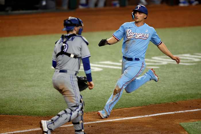 Jun 18, 2023; Arlington, Texas, USA; Texas Rangers shortstop Corey Seager (5) scores a run in the fourth inning against the Toronto Blue Jays at Globe Life Field. Mandatory Credit: Tim Heitman-USA TODAY Sports